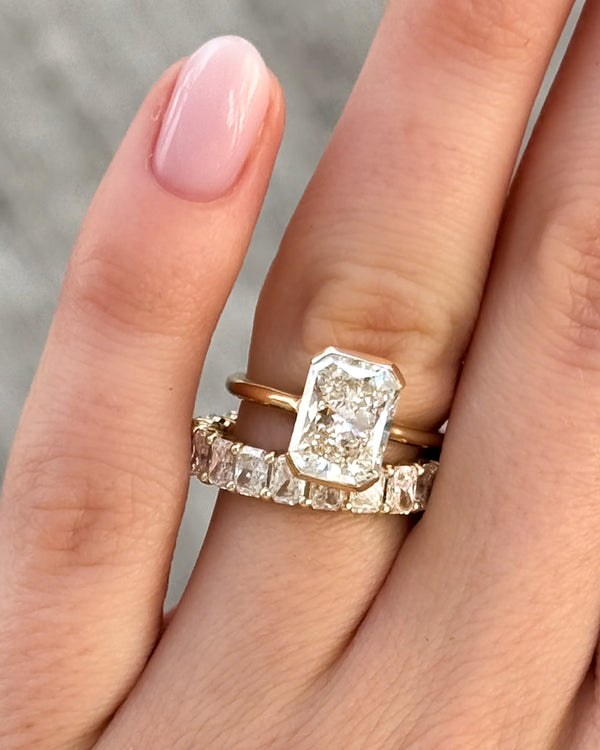 Petite Shared Prong Wedding Band with Radiant diamonds Good