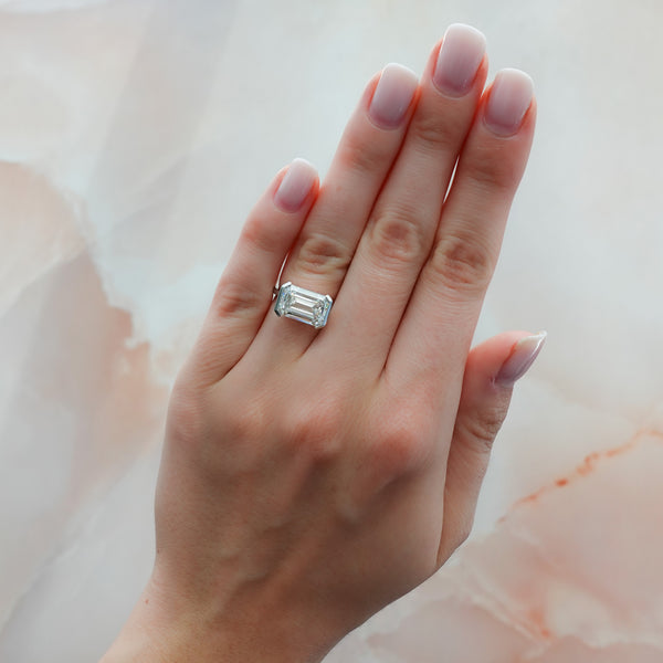 East West Half Bezel Solitaire Engagement Ring With Emerald Cut