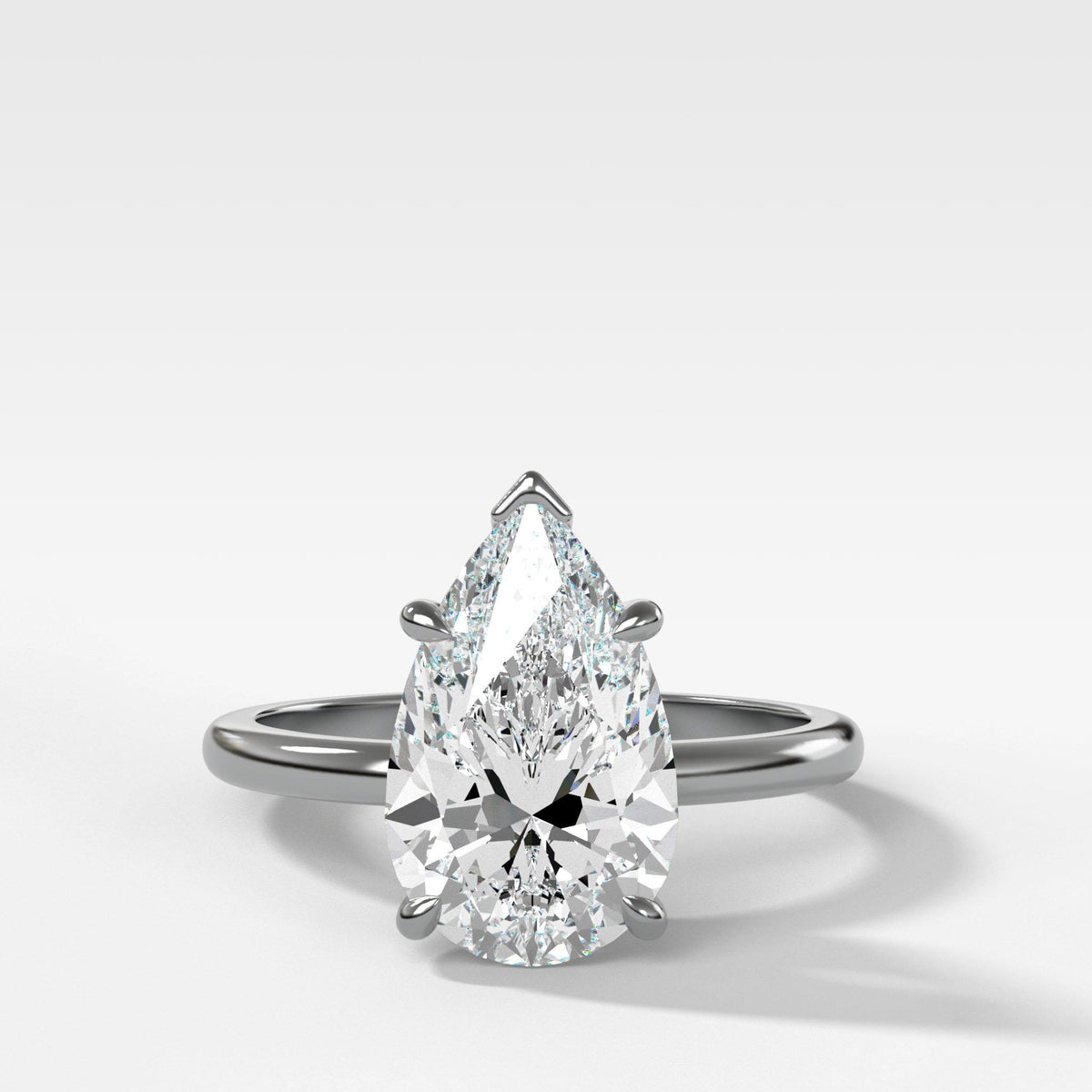 Crescent Solitaire With Pear Cut by Good Stone in White Gold
