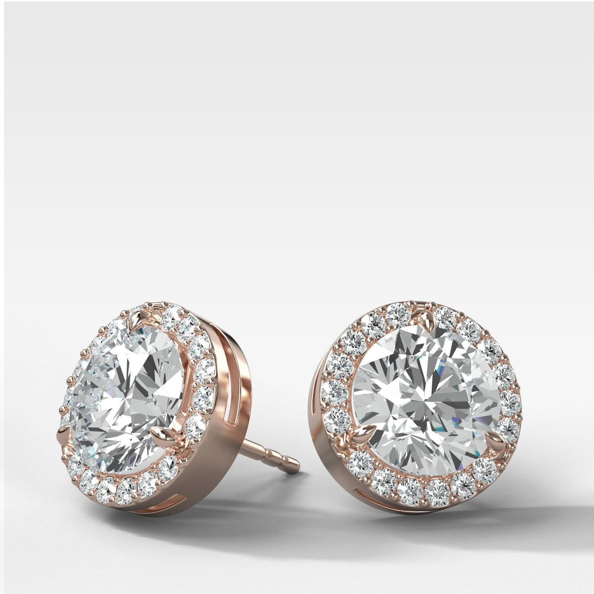 Round Cut Single Point Prong Studs With Micro Pavé Halo by Good Stone in Rose Gold