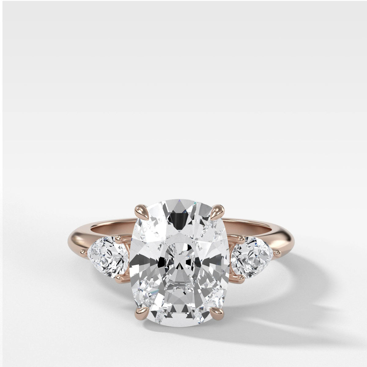 Three Stone Engagement Ring With Pear Side Stones and Elongated Cushion Cut by Good Stone in Rose Gold