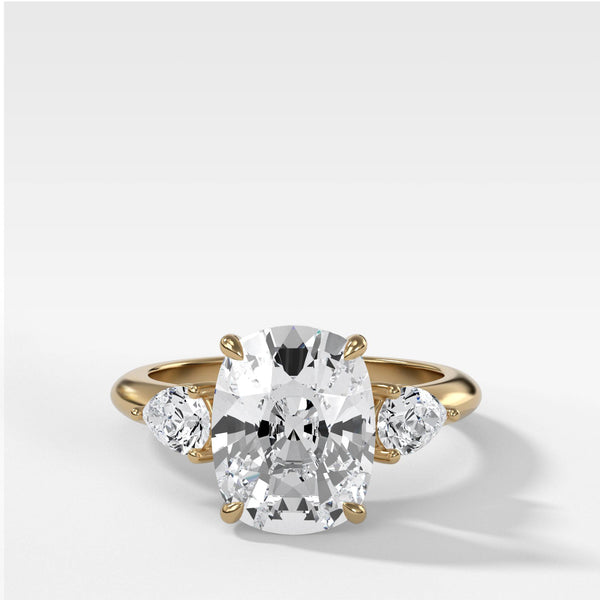 Three Stone Engagement Ring With Pear Side Stones and Elongated