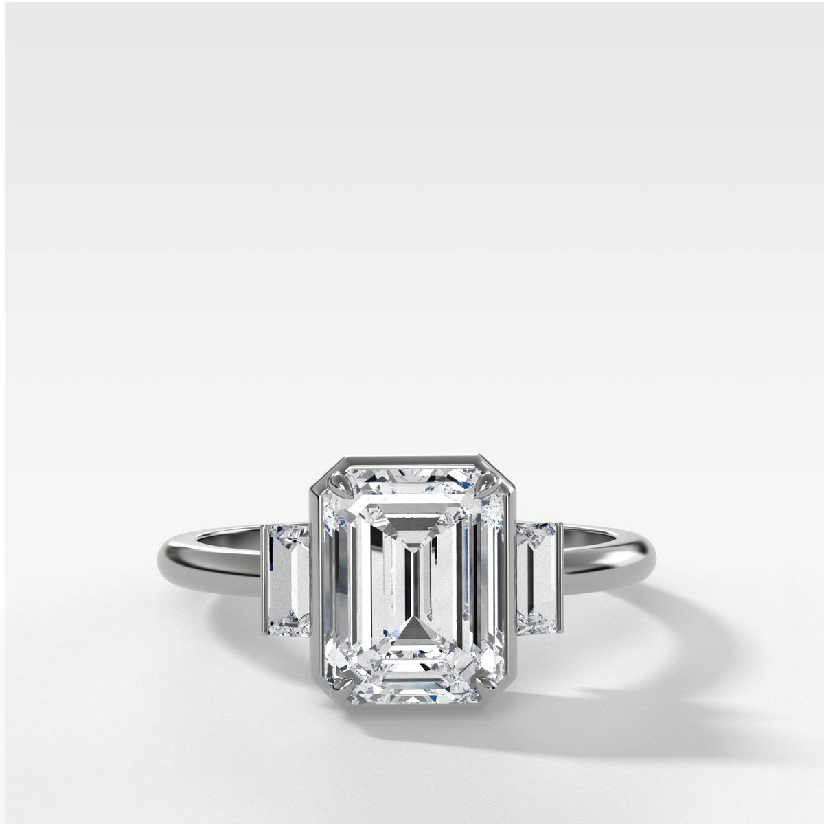 Three Stone Engagement Ring With Straight Baguette Side Stones and Emerald Cut by Good Stone in White Gold