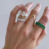 Green Emerald Oval Eternity Band by Good Stone available in Gold and Platinum