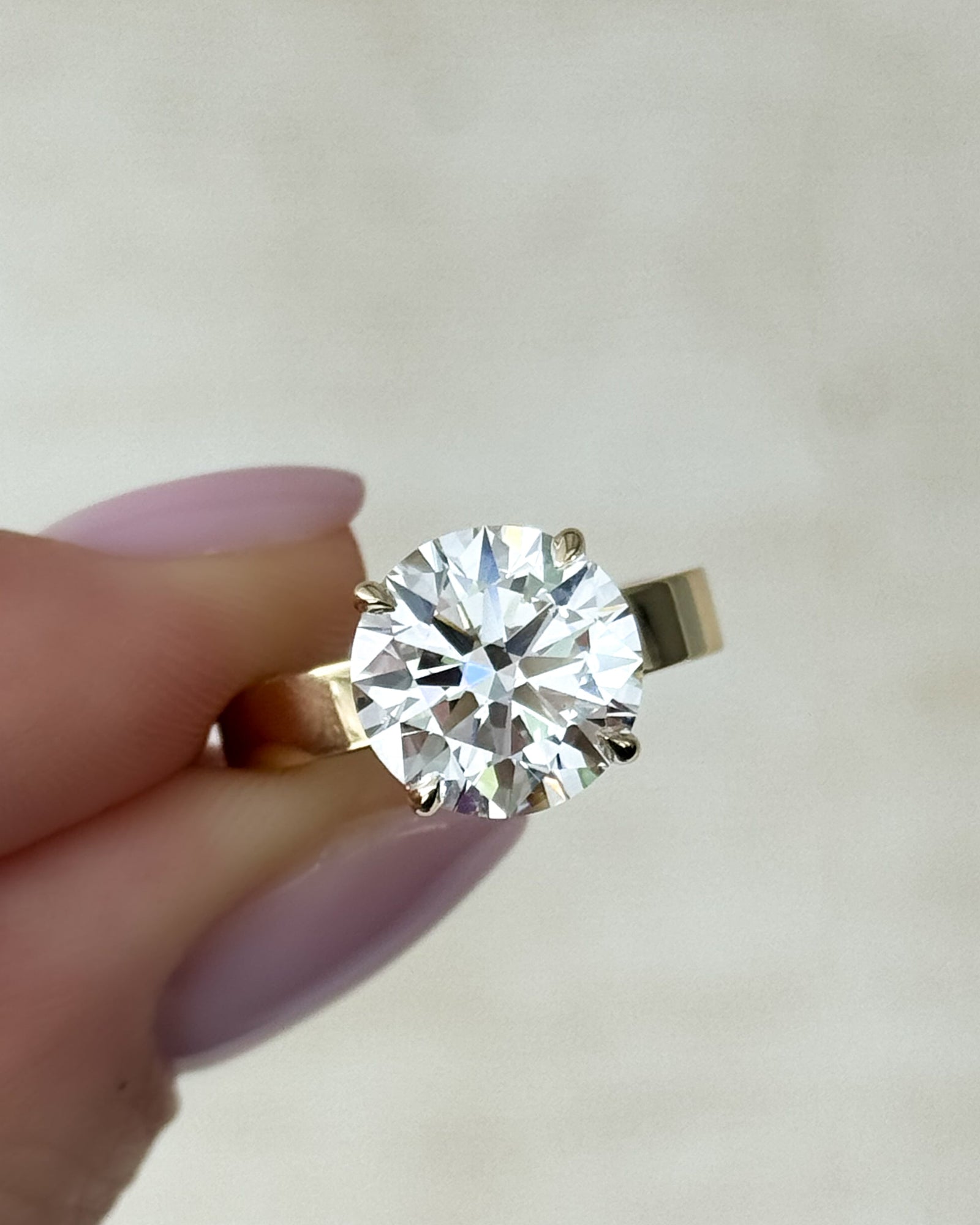 How to Buy a Round Solitaire Engagement Ring - GOODSTONE