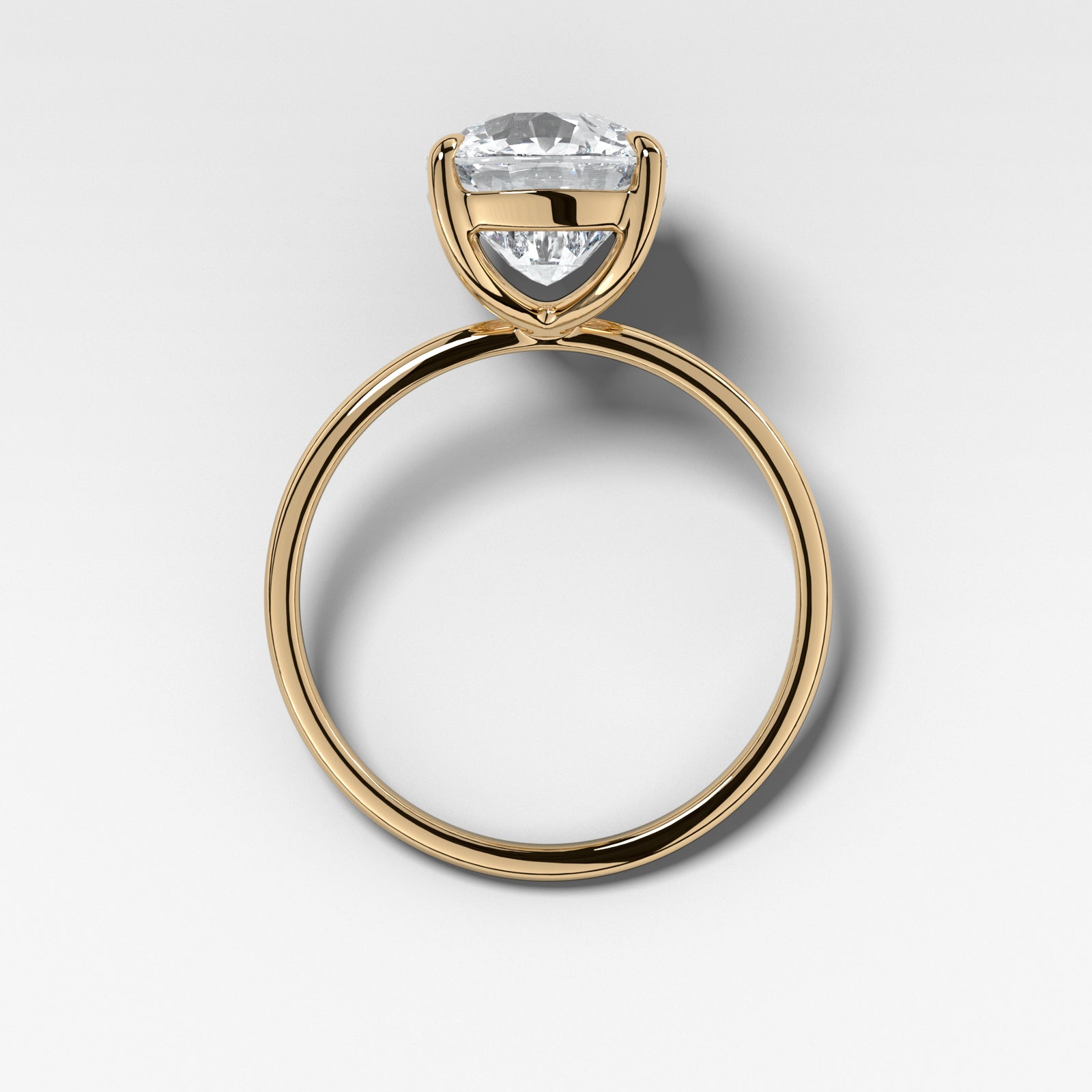 Crescent Solitaire With Elongated Cushion Cut by Good Stone in Yellow Gold