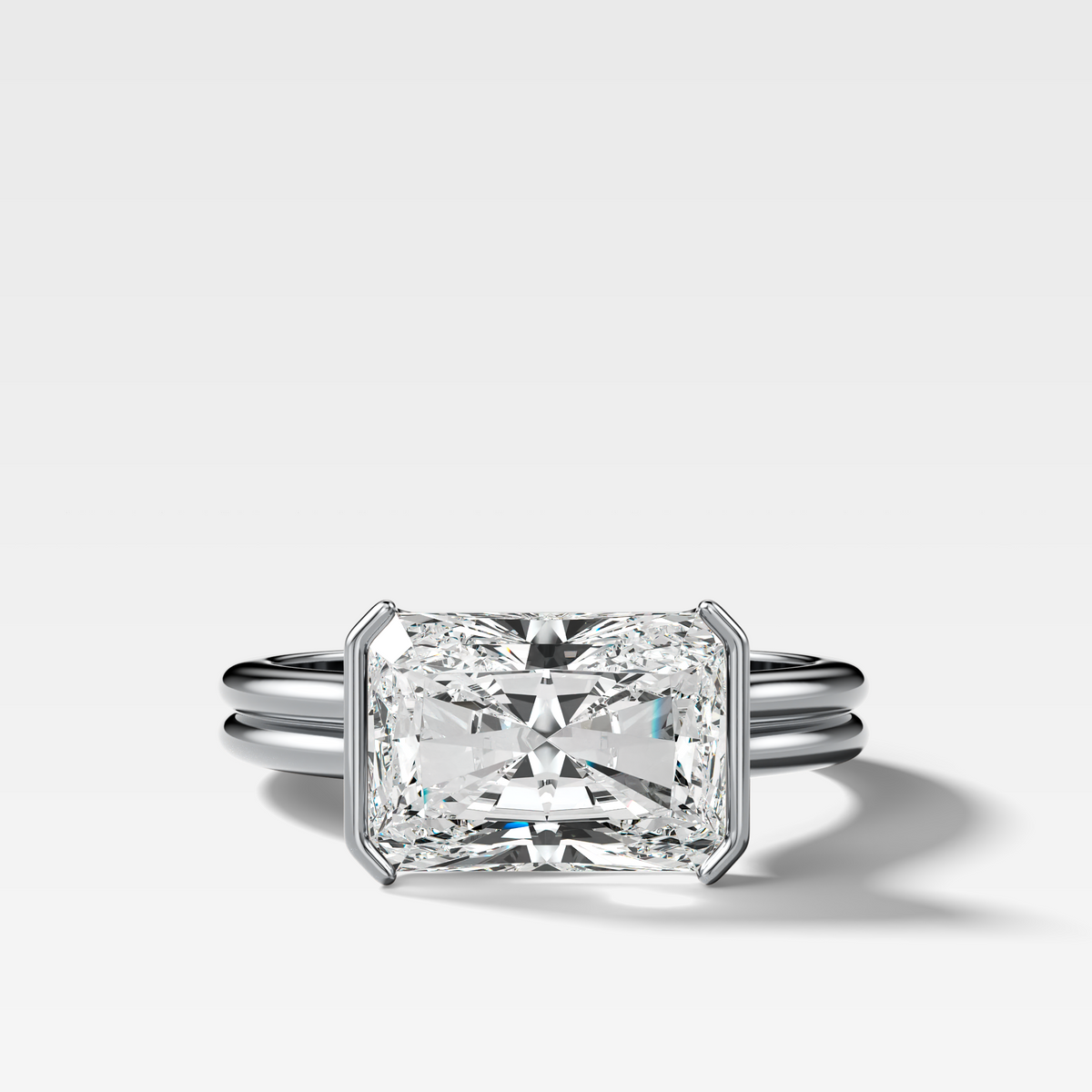 Double Row East West Half Bezel Solitaire Engagement Ring With Elongated Radiant Cut Diamond