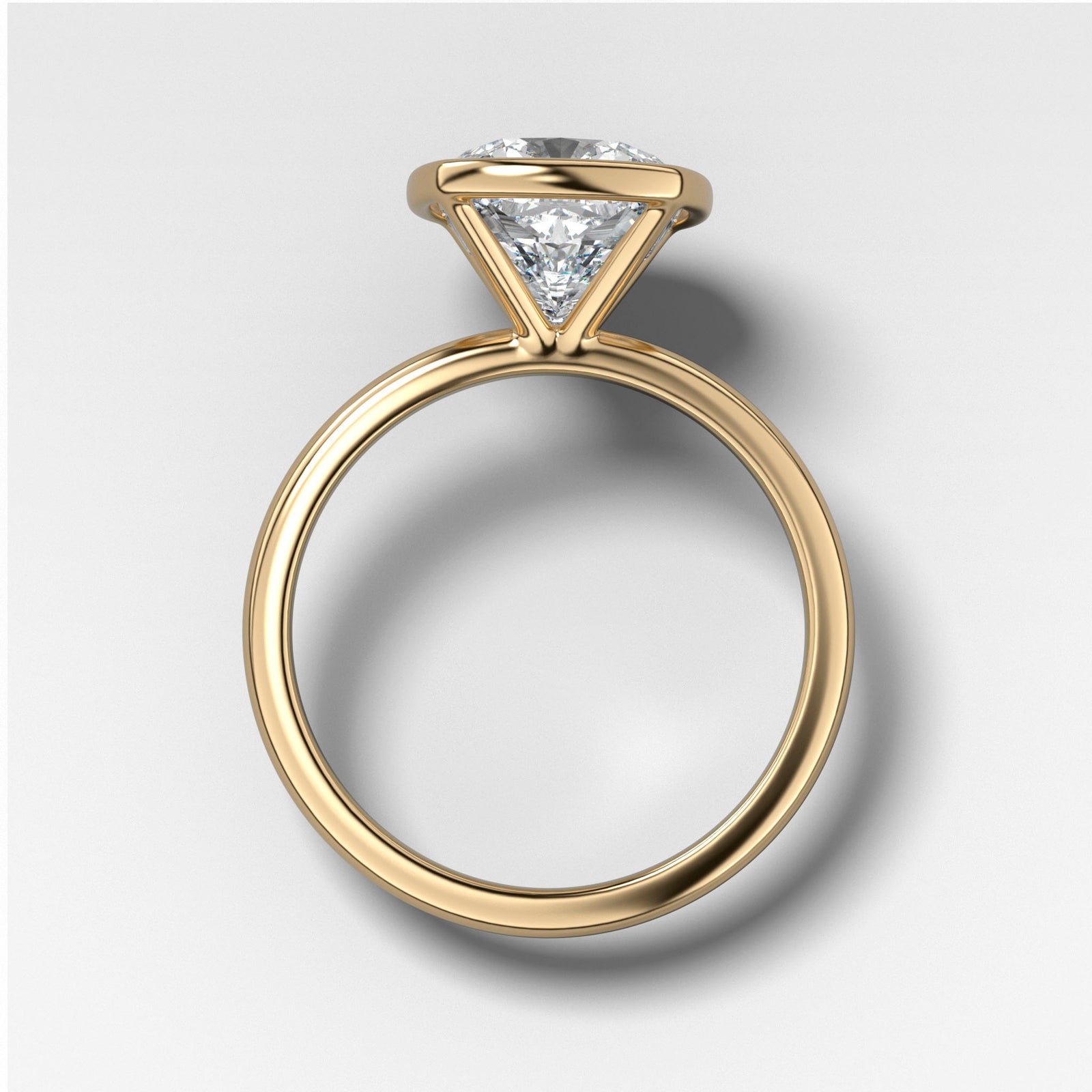 Bezel Penumbra Solitaire With Elongated Cushion Cut by Good Stone in Yellow Gold