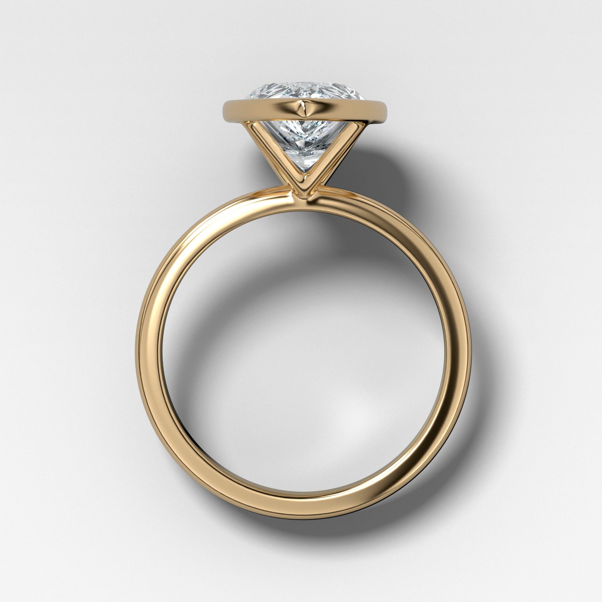 Bezel Penumbra Solitaire With Pear Cut by Good Stone in Yellow Gold