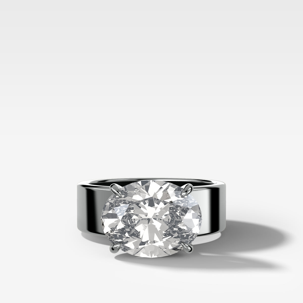 Finest Cigar Band Engagement Ring with East West Oval Cut Diamond