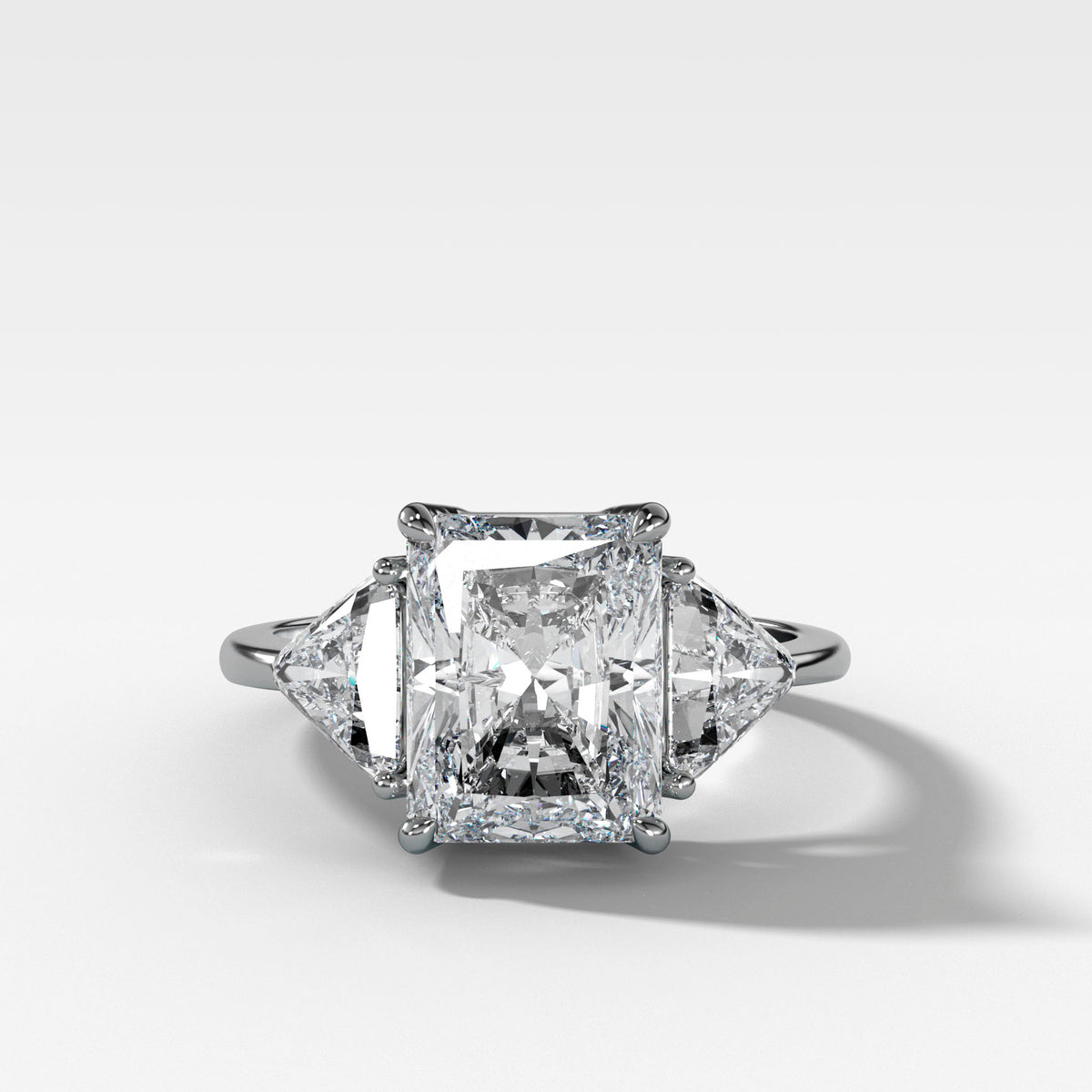 Three Stone Engagement Ring with Shield Side Stones and a Radiant cut Diamond
