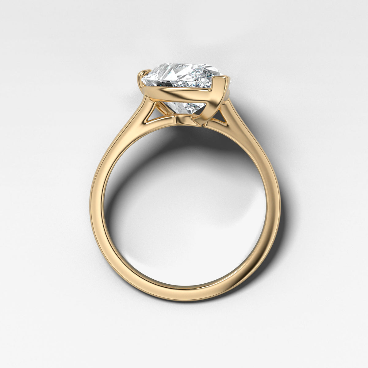 Tilted Thin + Simple Solitaire Engagement Ring With Pear Cut Diamond