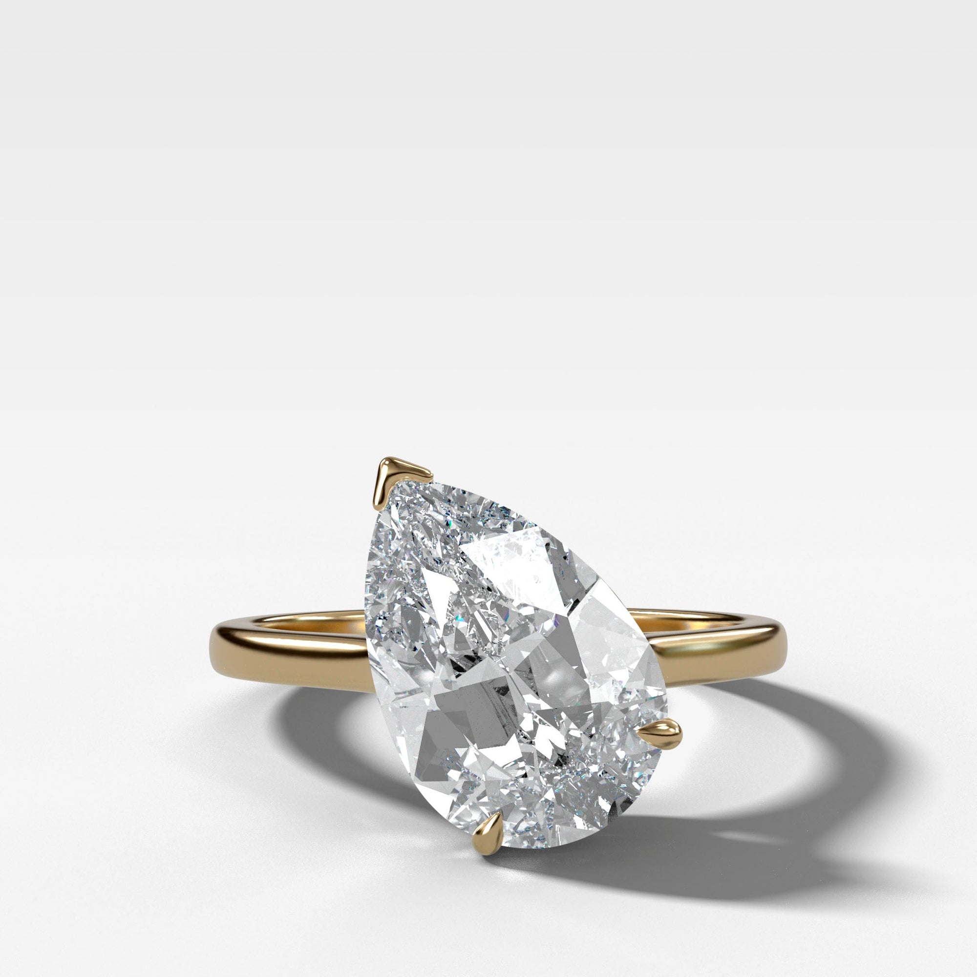 Tilted Thin + Simple Solitaire Engagement Ring With 3.04ct Pear Cut Lab Grown Diamond