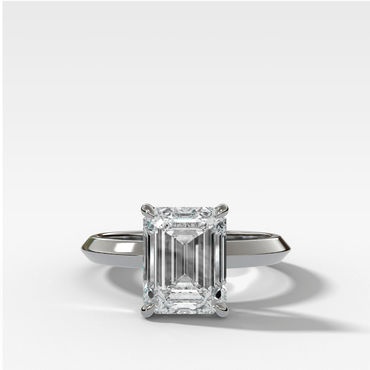 Butter Knife Solitaire Engagement Ring With Emerald Cut Diamond