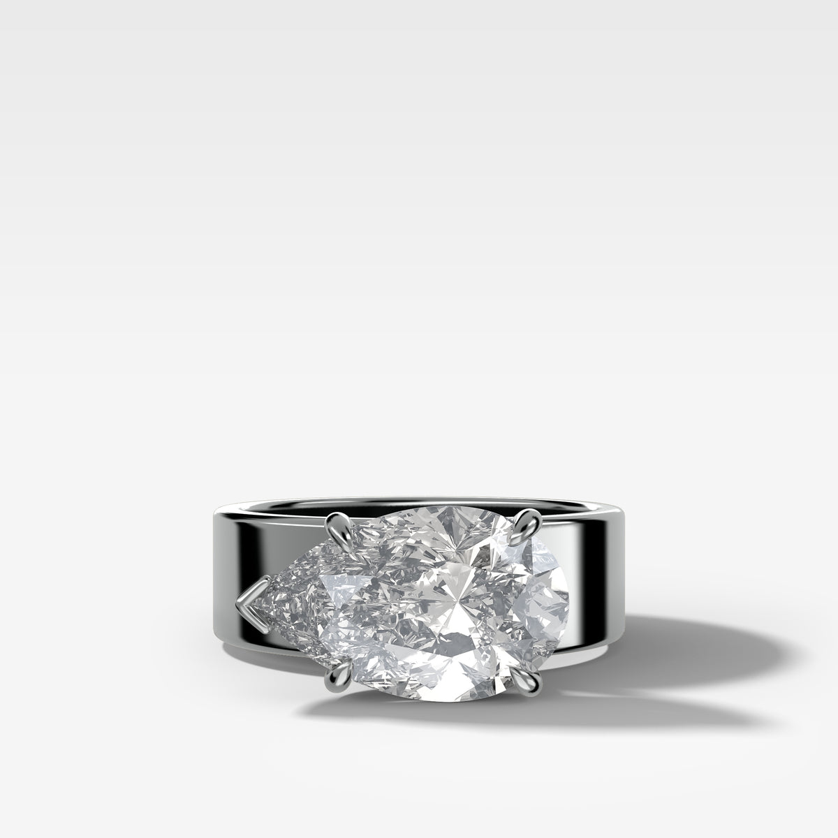 Finest Cigar Band Engagement Ring with East West Pear Cut Diamond