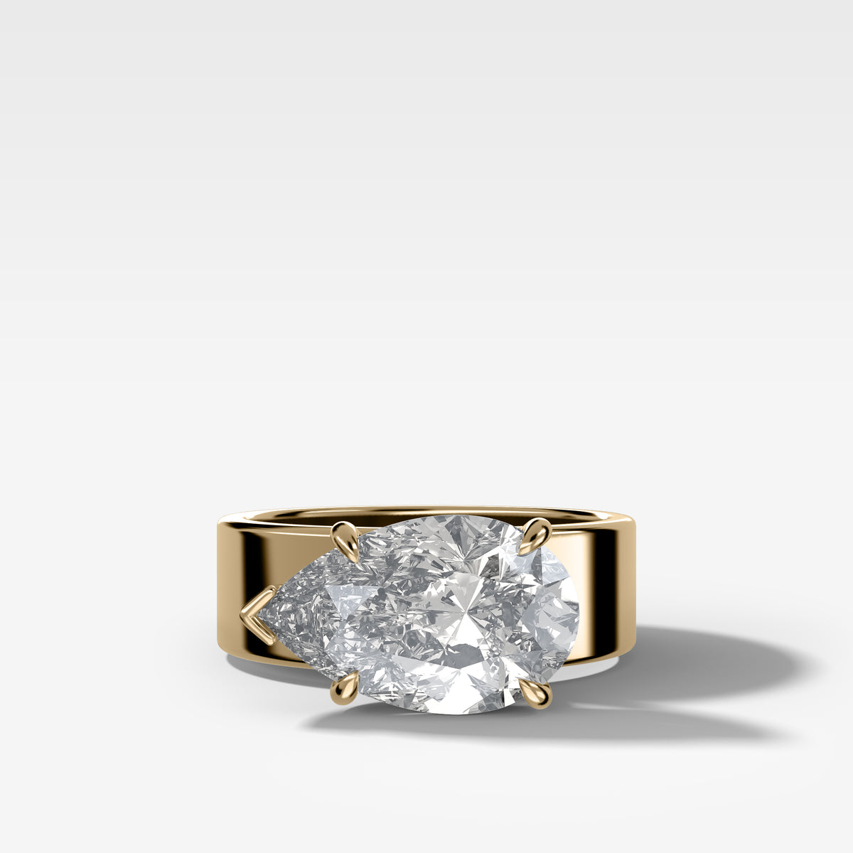 Finest Cigar Band Engagement Ring with East West Pear Cut Diamond
