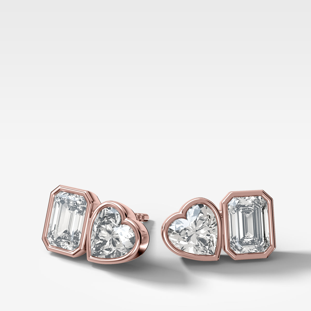 Toi et Moi Bezel Set Diamond Studs with Emerald and Heart Cuts