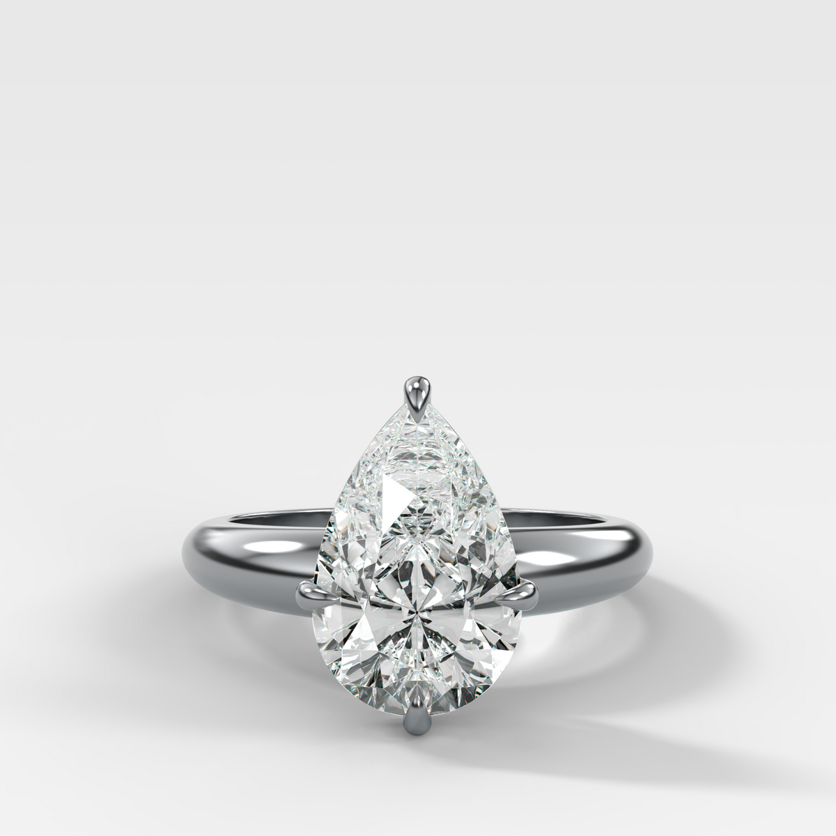 Compass Tapered Dome Engagement Ring With a Pear Diamond