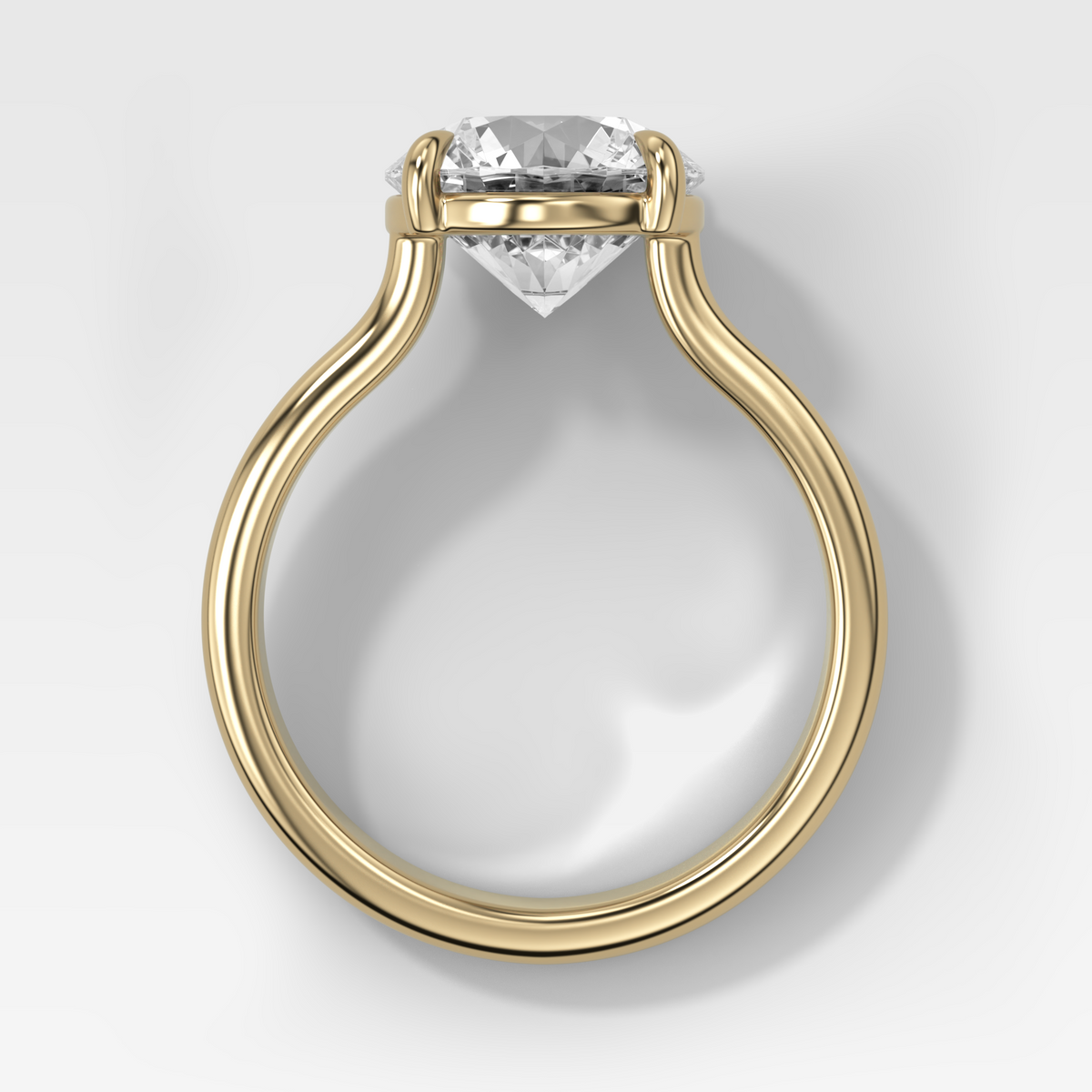 Anillo de compromiso con solitario de medio bisel y doble hilera con diamante de talla esmeralda