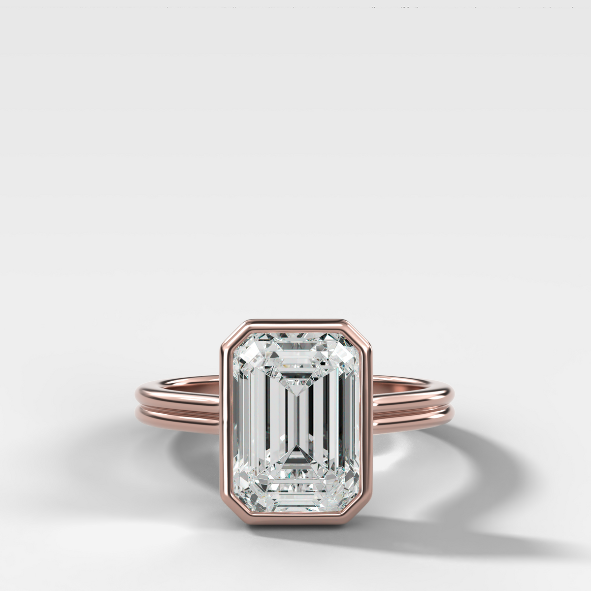 Double Row Penumbra Bezel Engagement Ring With Emerald Cut Diamond