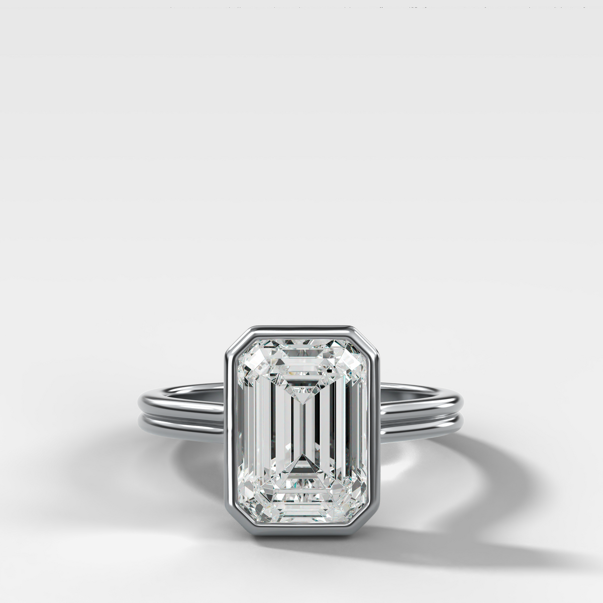 Double Row Penumbra Bezel Engagement Ring With Emerald Cut Diamond