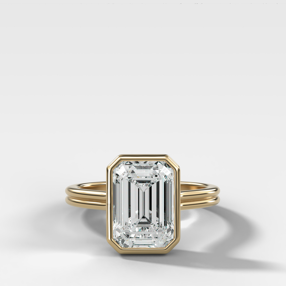 Double Row Penumbra Bezel Engagement Ring With Emerald Cut Diamond