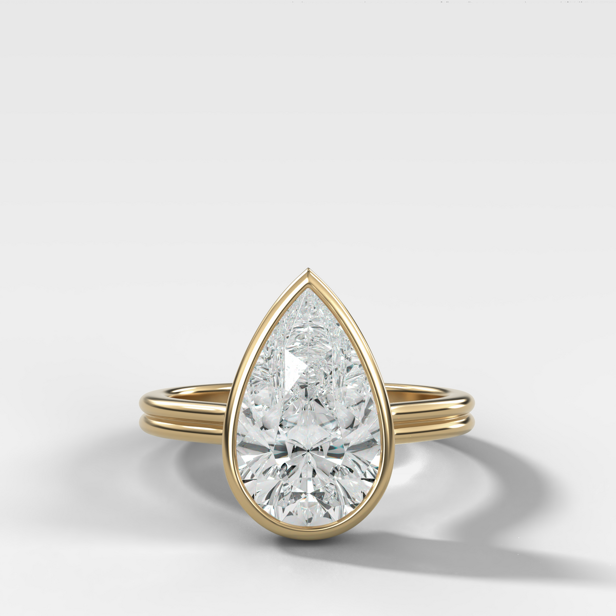 Double Row Penumbra Bezel Engagement Ring With Pear Cut Diamond
