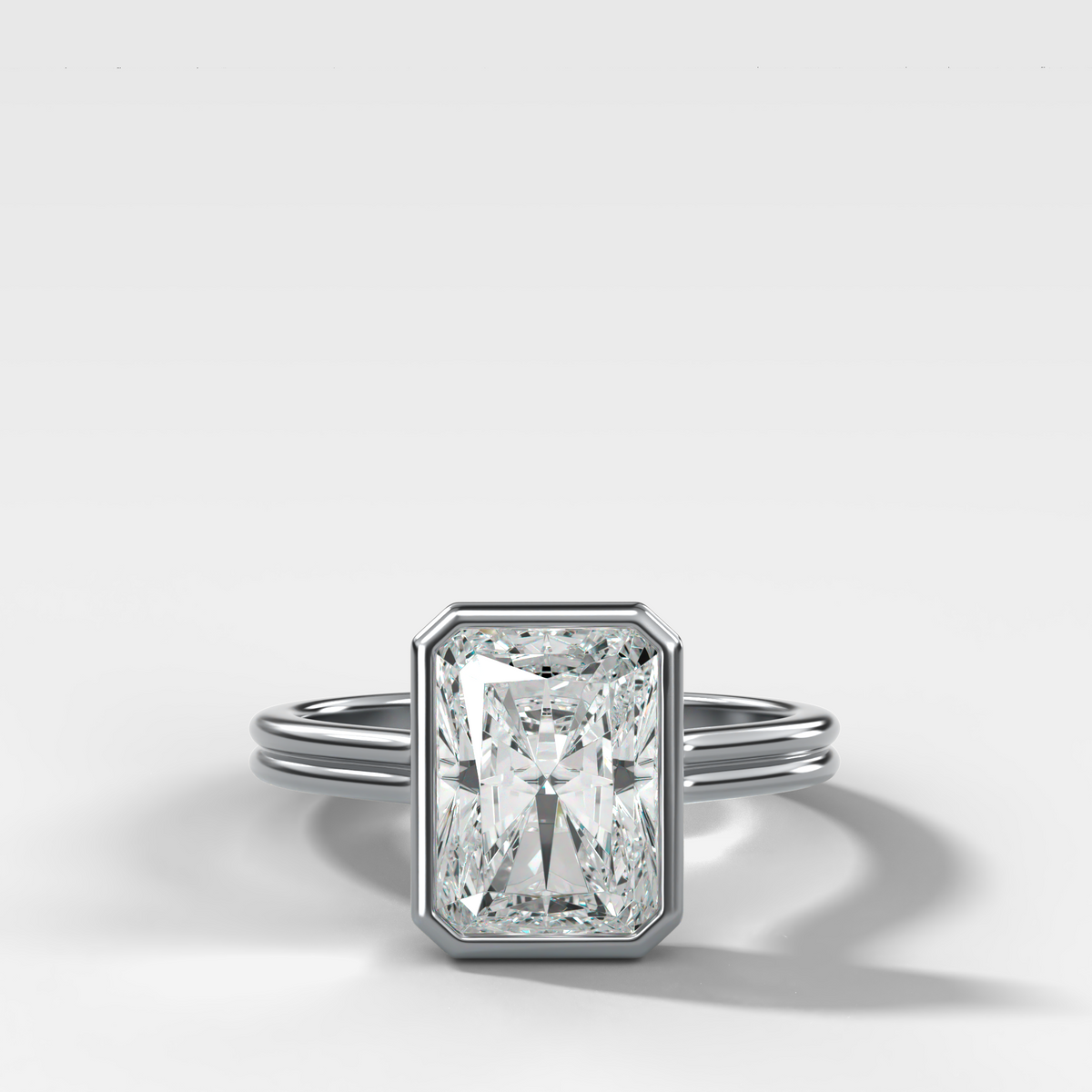 Double Row Penumbra Bezel Engagement Ring With Elongated Radiant Cut Diamond