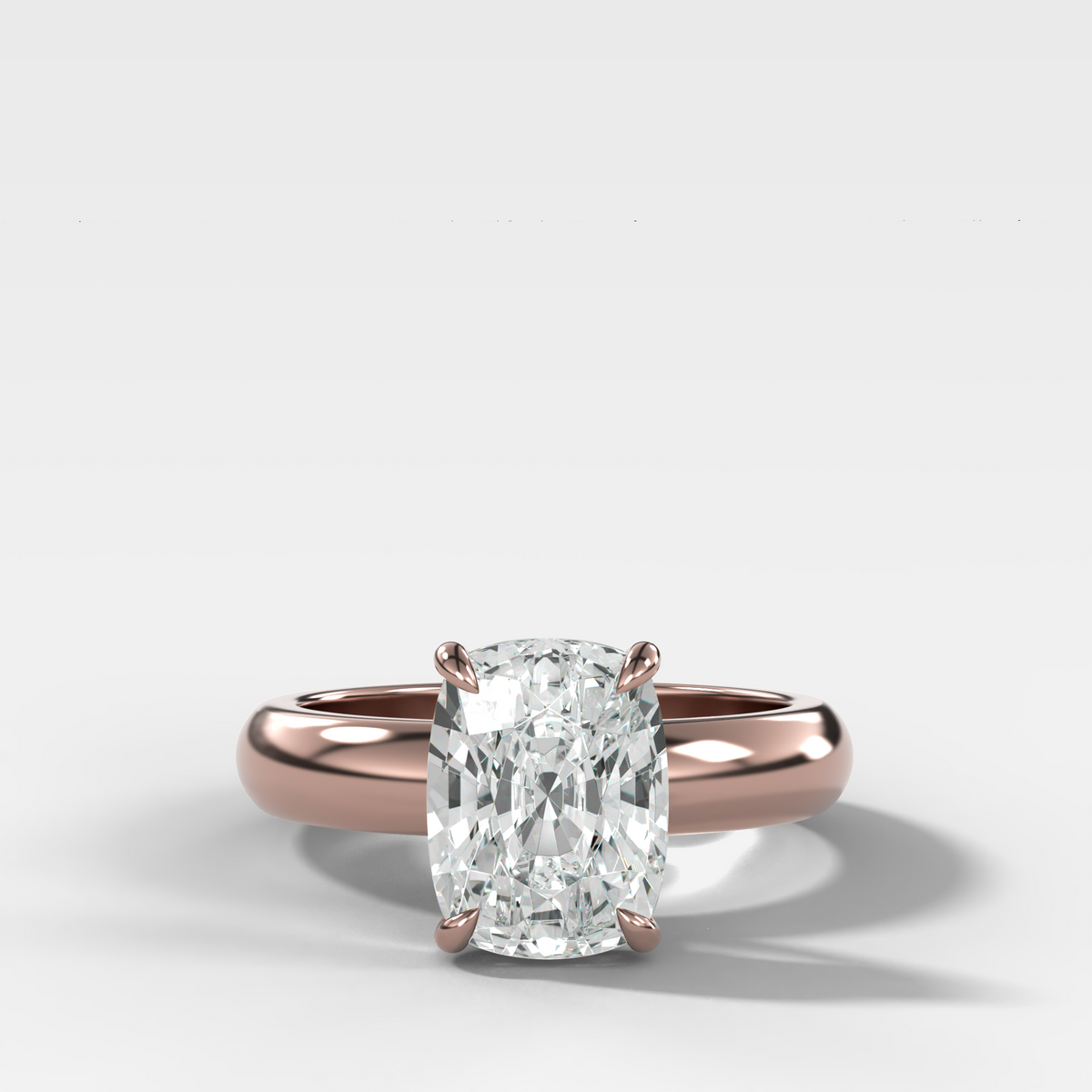 Domed Solitaire Engagement Ring with an Elongated Cushion Cut Diamond
