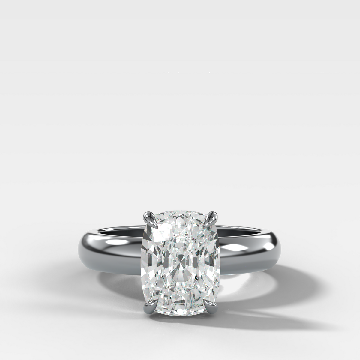 Domed Solitaire Engagement Ring with an Elongated Cushion Cut Diamond