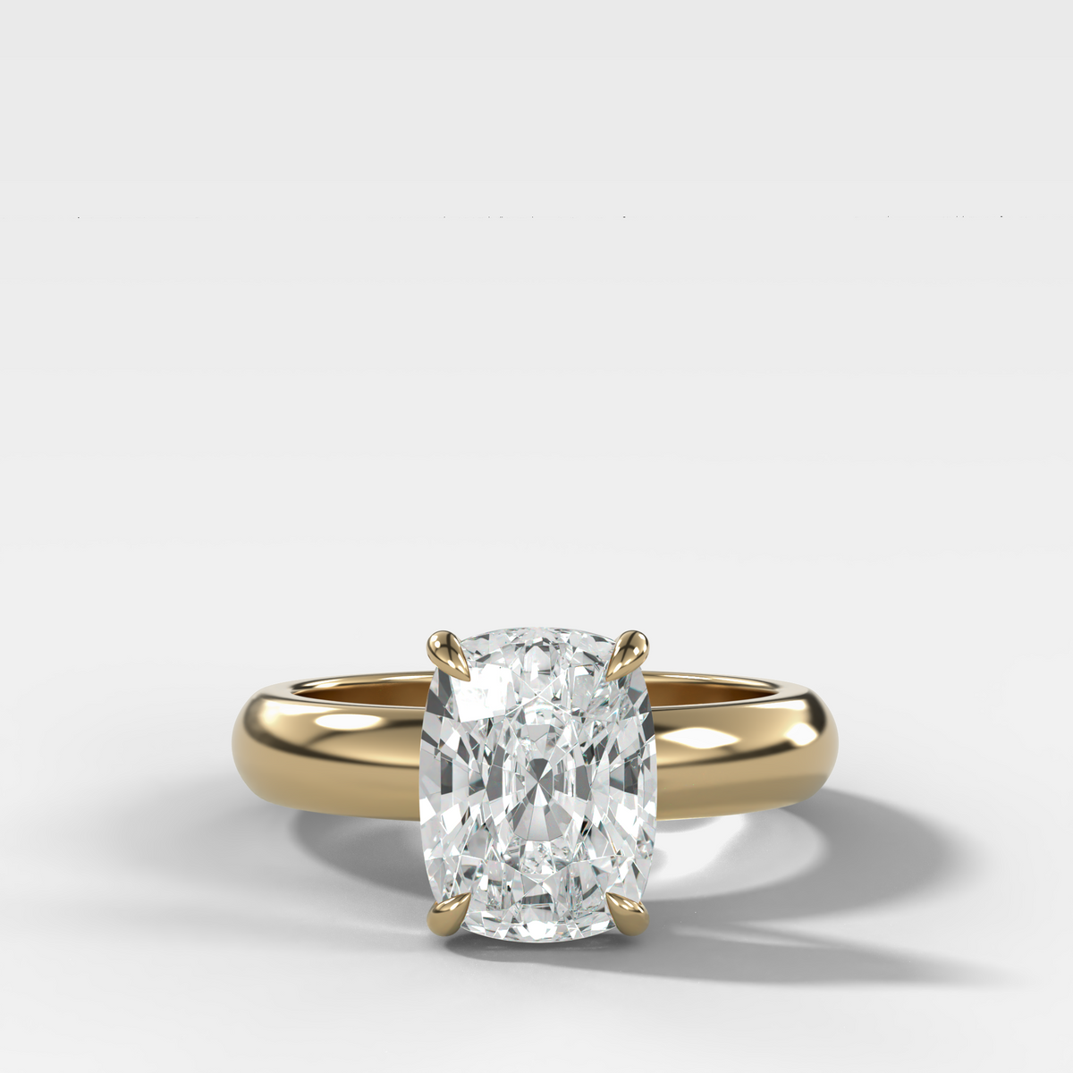Domed Solitaire Engagement Ring with an Elongated Cushion Cut Diamond