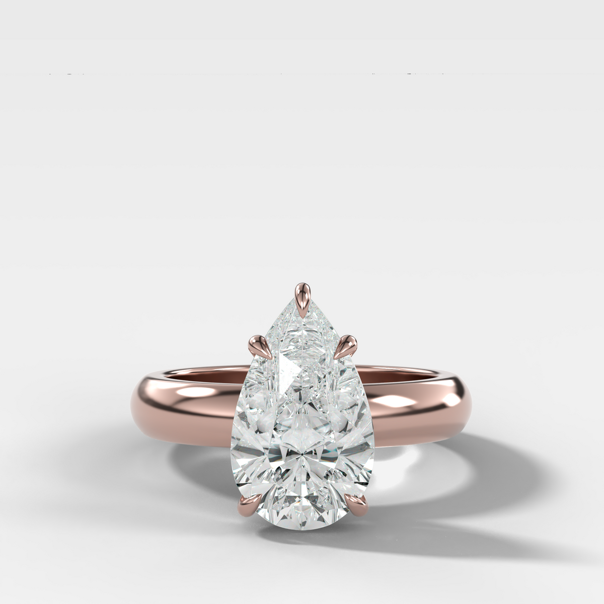 Domed Solitaire Engagement Ring with a Pear Cut Diamond