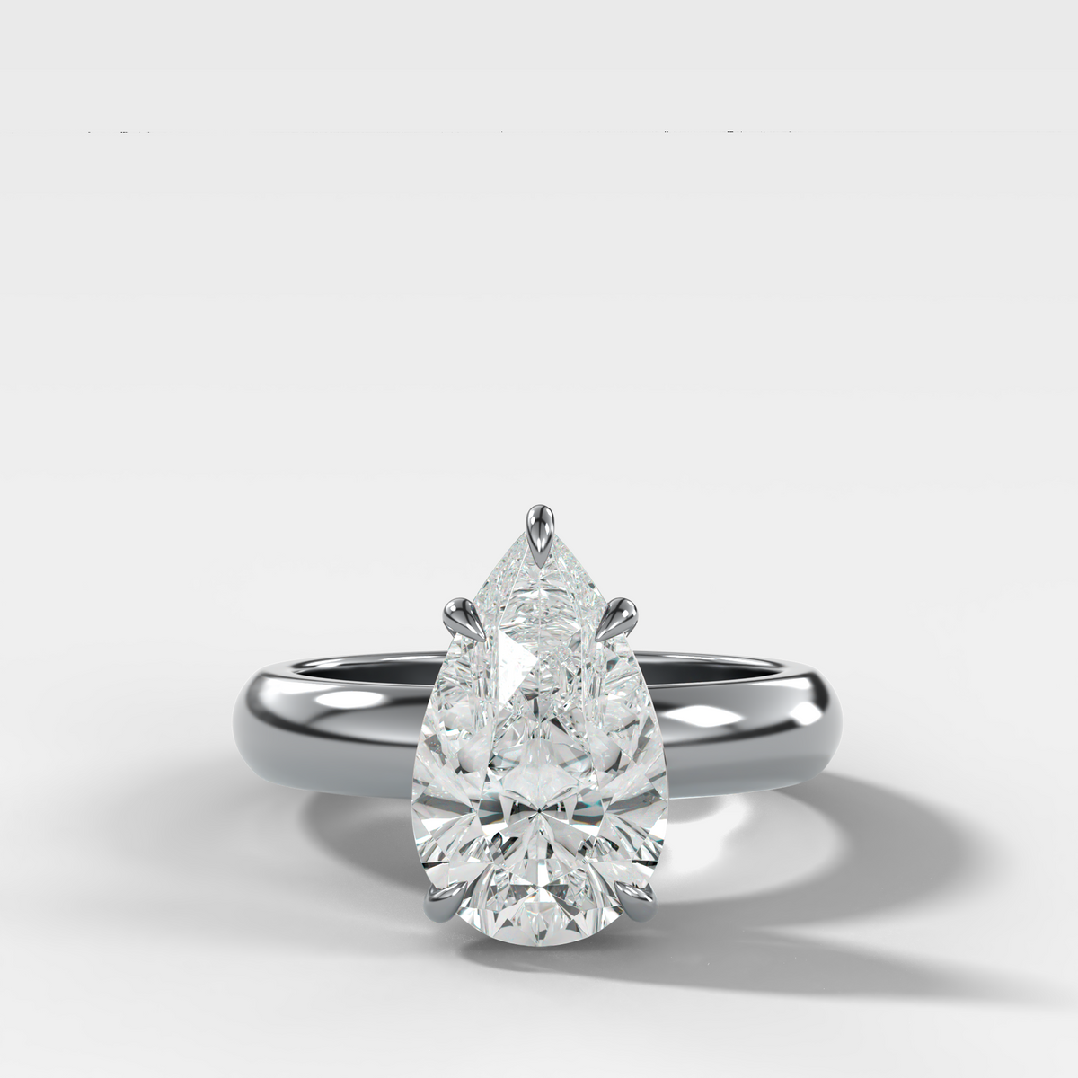 Domed Solitaire Engagement Ring with a Pear Cut Diamond