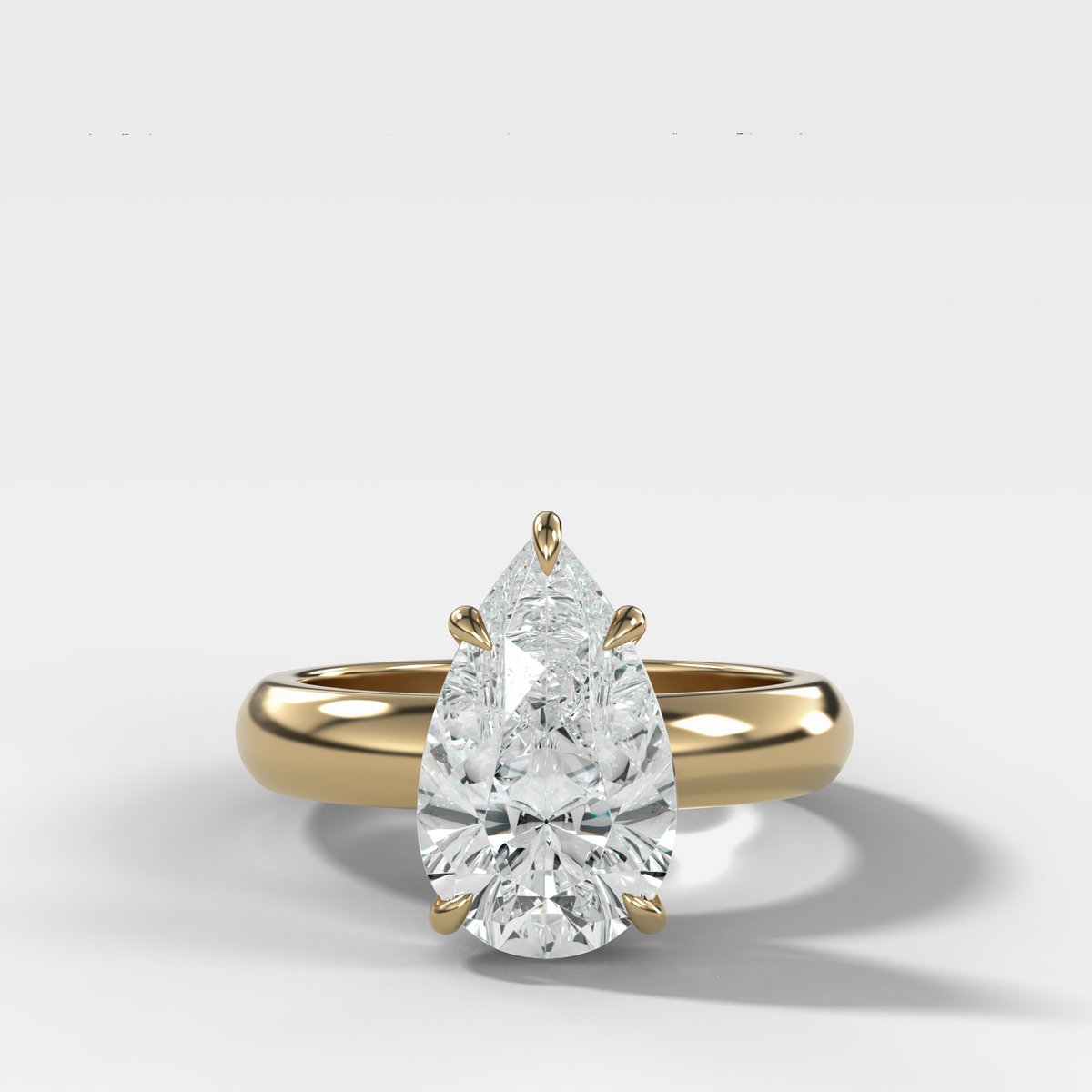 Domed Solitaire Engagement Ring with a Pear Cut Diamond