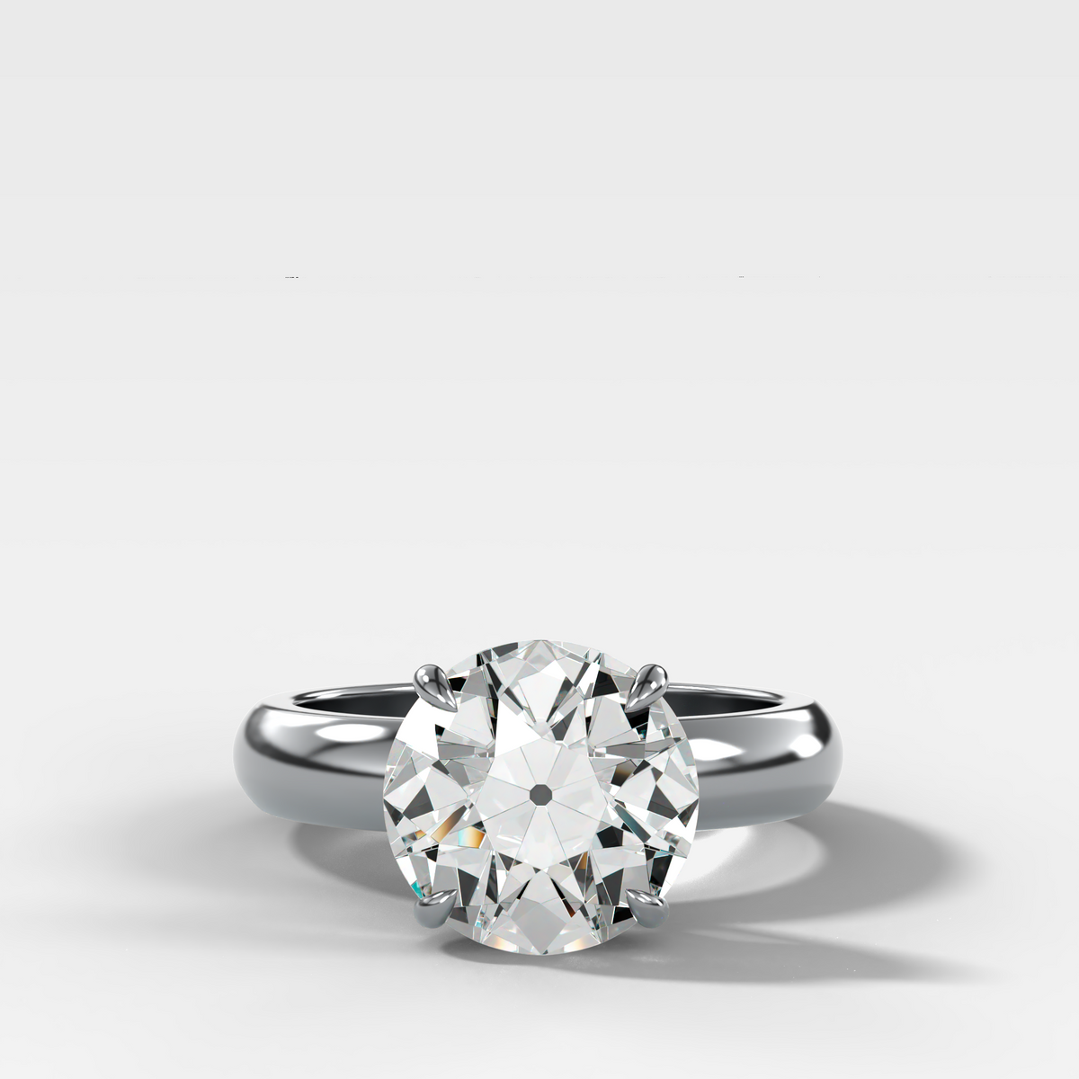 Anillo de compromiso con solitario de medio bisel y doble hilera con diamante de talla esmeralda