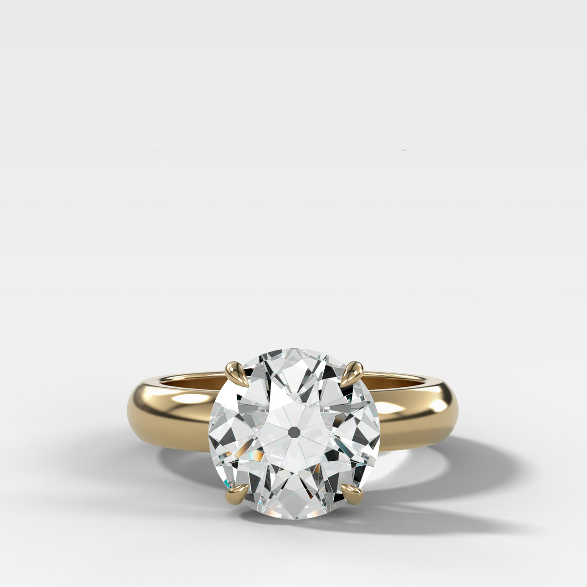 Anillo de compromiso con solitario de medio bisel y doble hilera con diamante de talla esmeralda