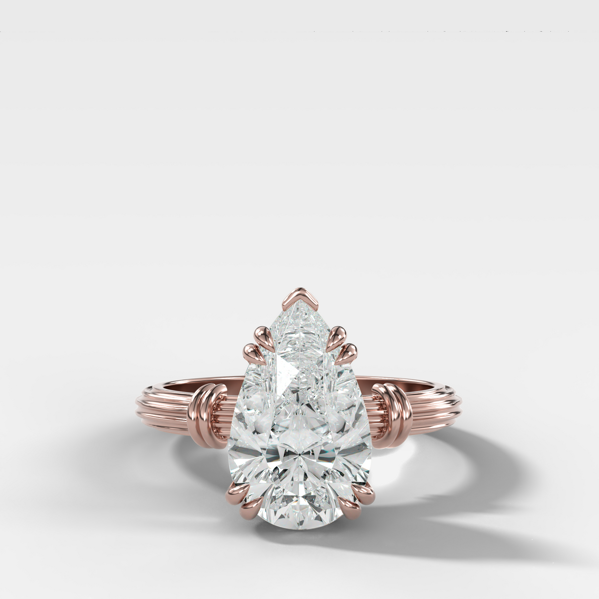 Ridged Band Knot Engagement Ring with Pear Cut Diamond