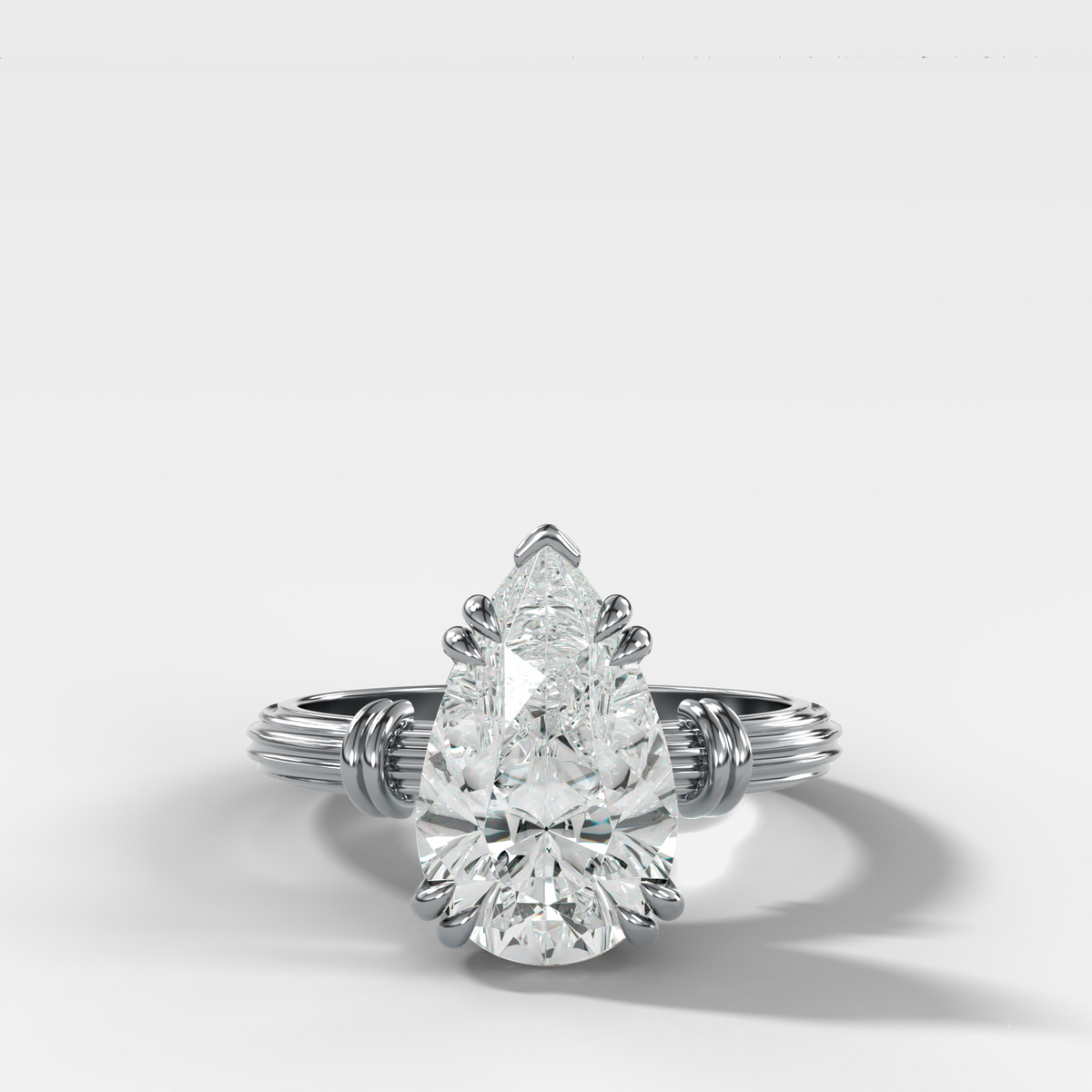 Ridged Band Knot Engagement Ring with Pear Cut Diamond