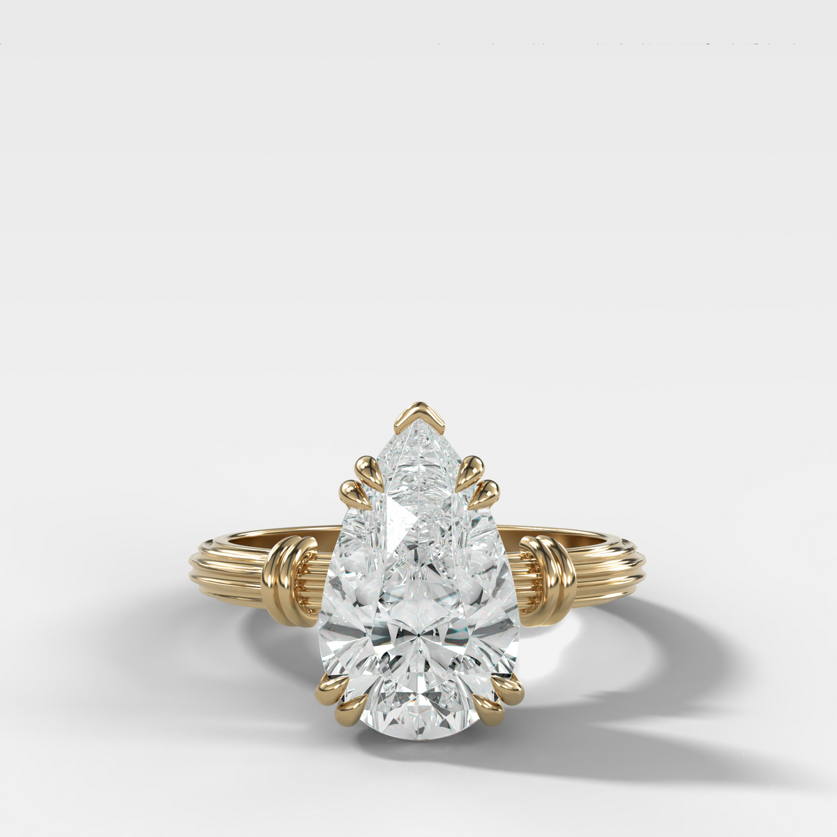 Ridged Band Knot Engagement Ring with Pear Cut Diamond