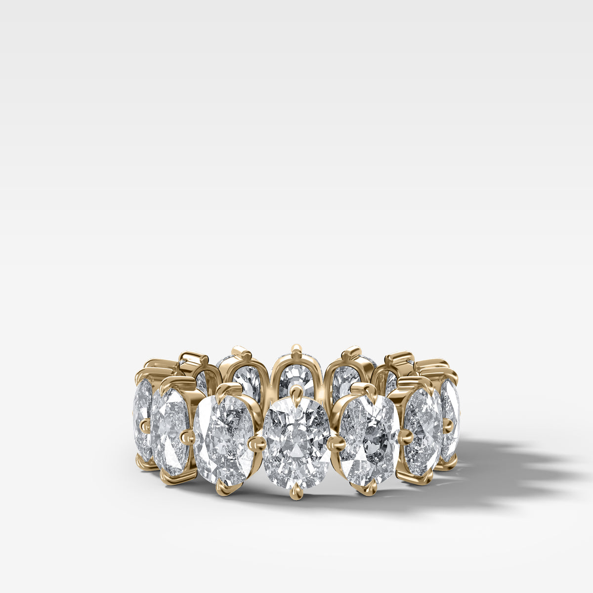 Compass-Set Eternity Band with Elongated Cushion Cut Diamonds