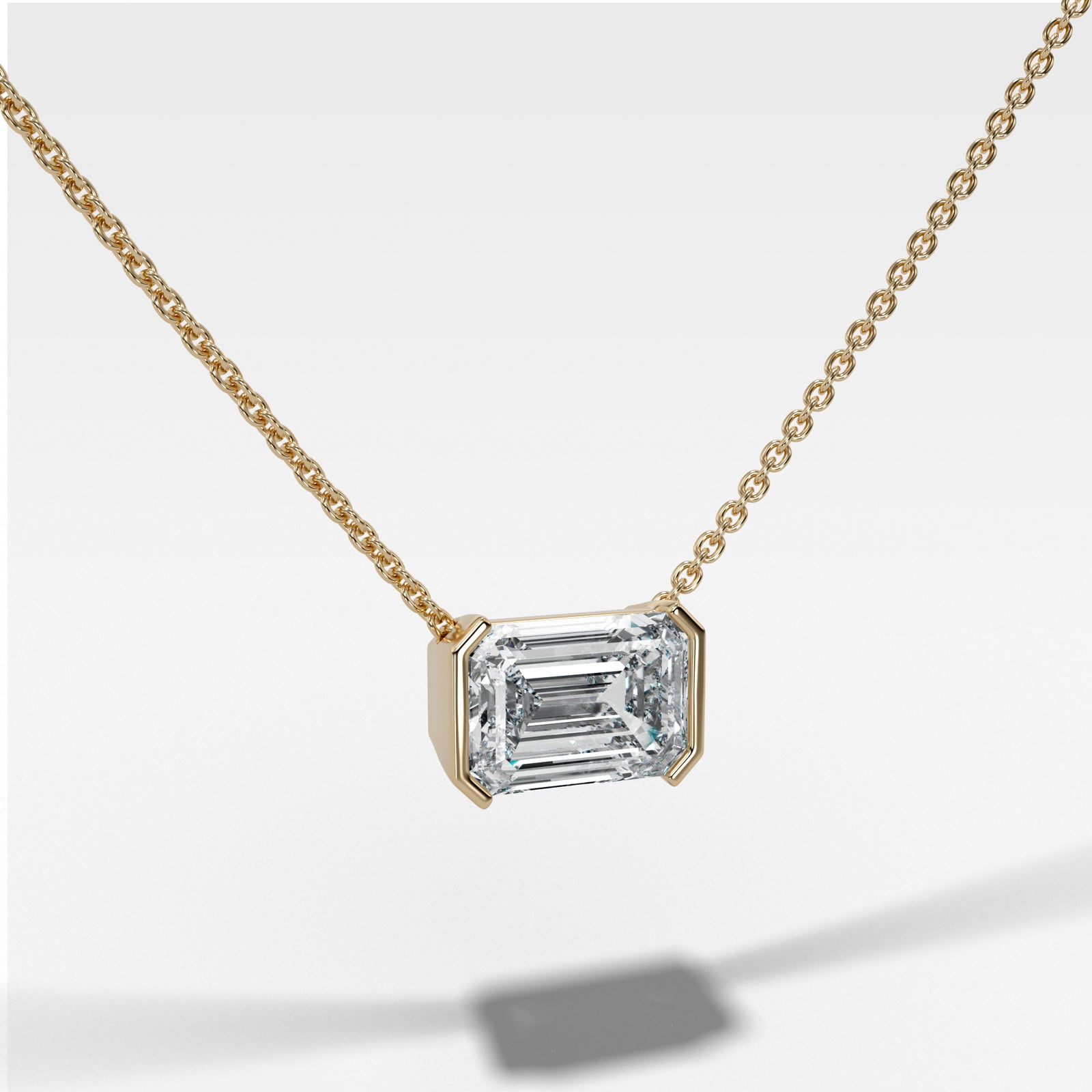East West Half Bezel Pendant Necklace with Emerald Cut Diamond