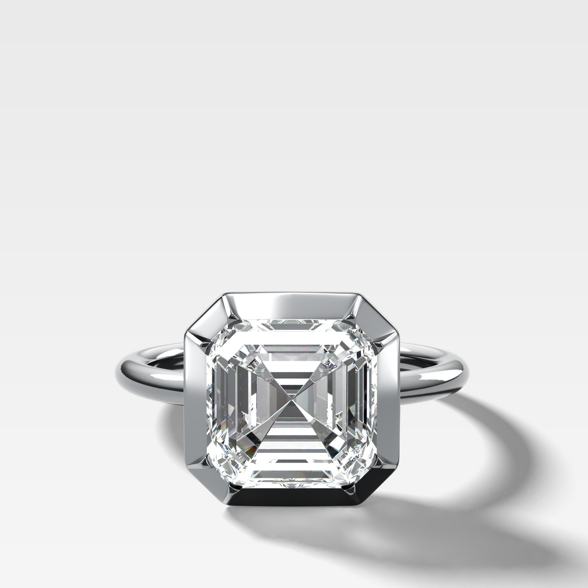 Button Back Solitaire Engagement Ring With an Asscher Cut Diamond