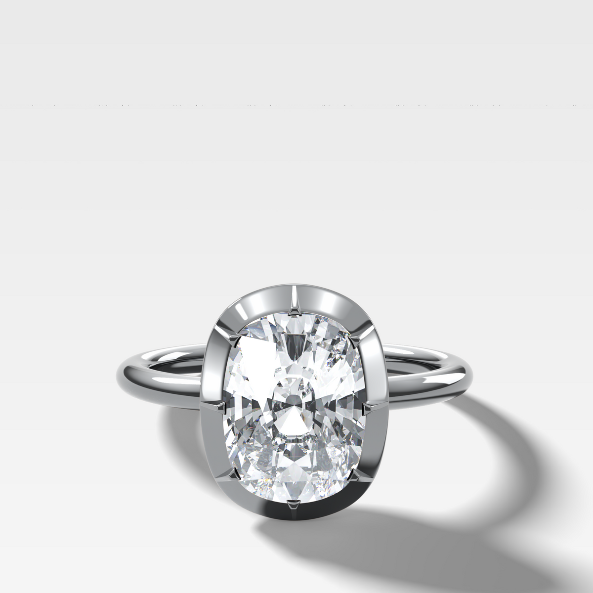 Button Back Solitaire Engagement Ring With an Elongated Cushion Cut Diamond