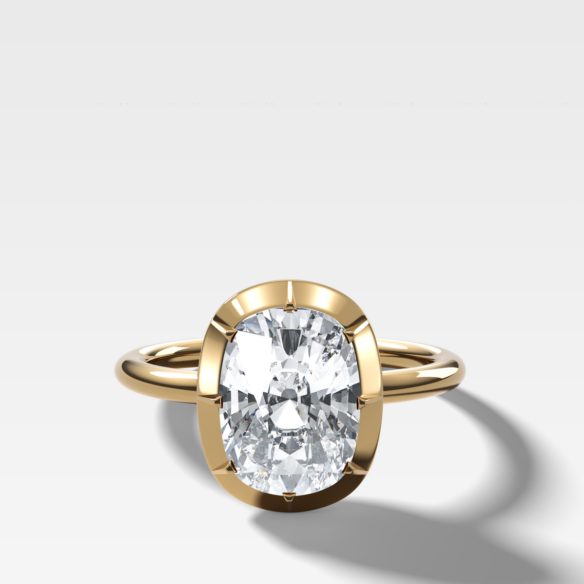 Button Back Solitaire Engagement Ring With an Elongated Cushion Cut Diamond