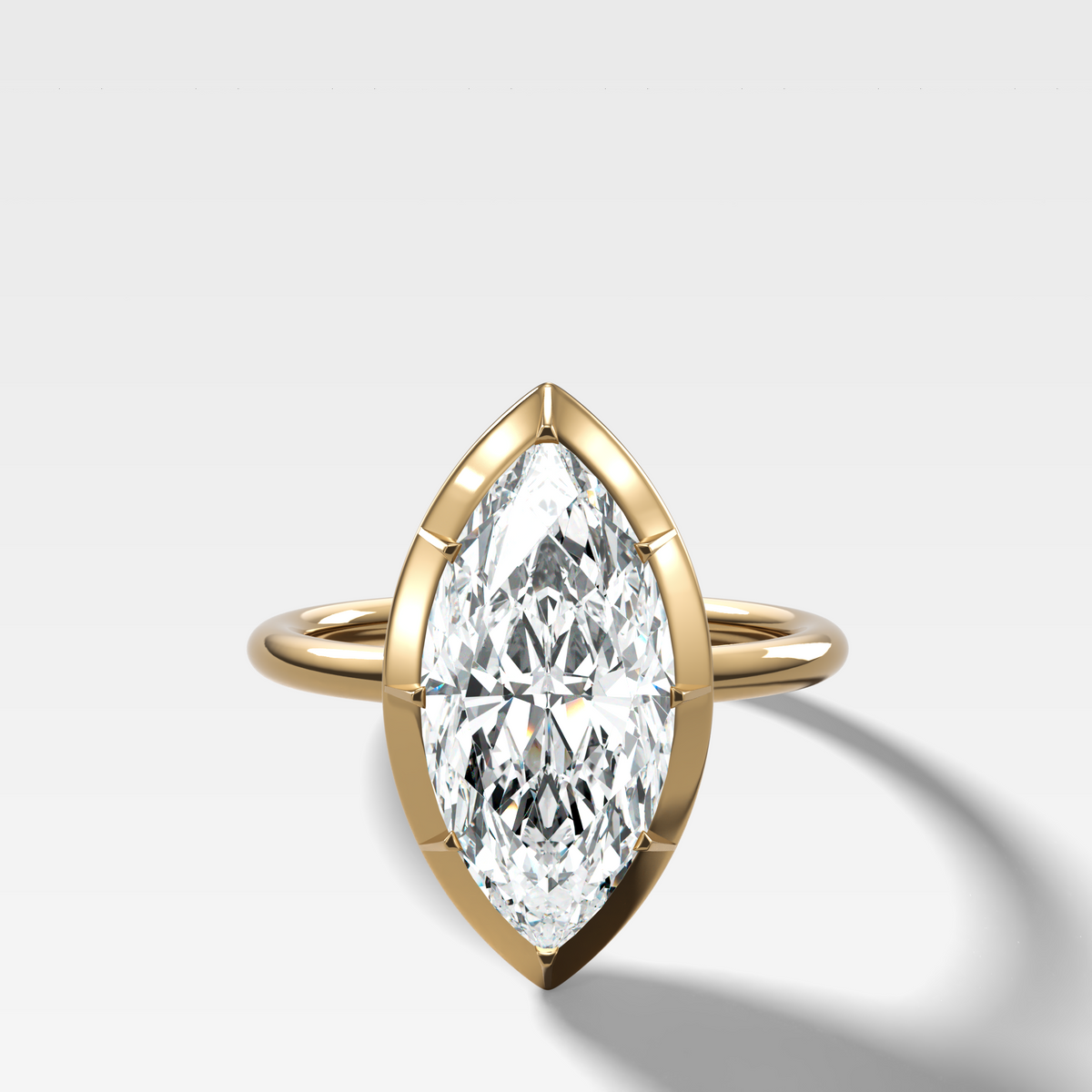 Button Back Solitaire Engagement Ring With a Marquise Cut Diamond