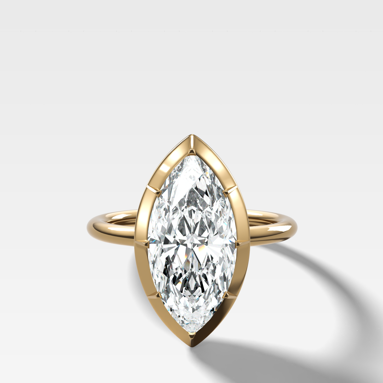 Button Back Solitaire Engagement Ring With a Marquise Cut Diamond