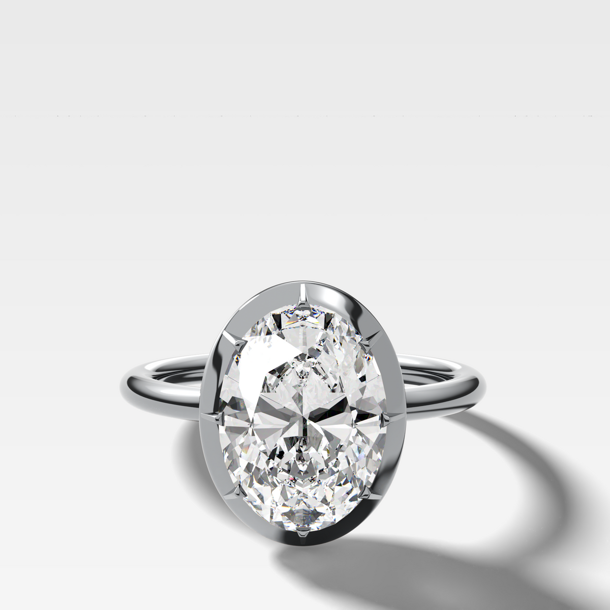 Button Back Solitaire Engagement Ring With an Oval Cut Diamond