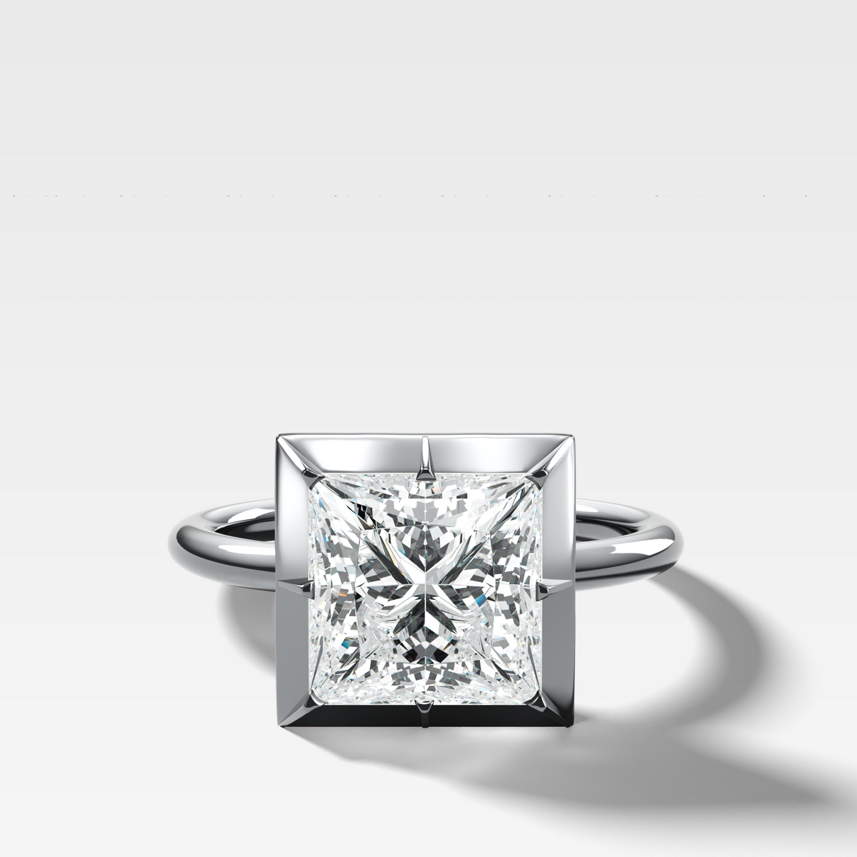Button Back Solitaire Engagement Ring With a Princess Cut Diamond