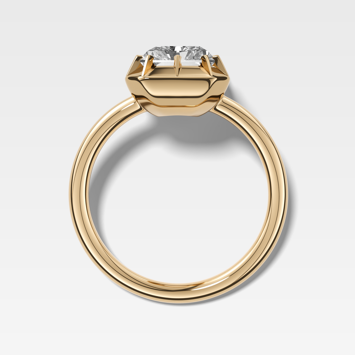 Button Back Solitaire Engagement Ring With an Elongated Radiant Cut Diamond