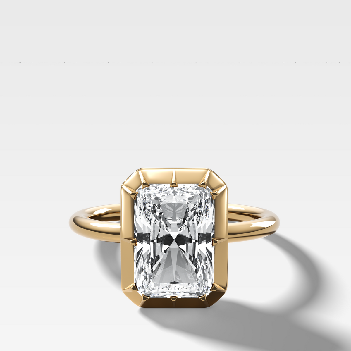 Button Back Solitaire Engagement Ring With an Elongated Radiant Cut Diamond